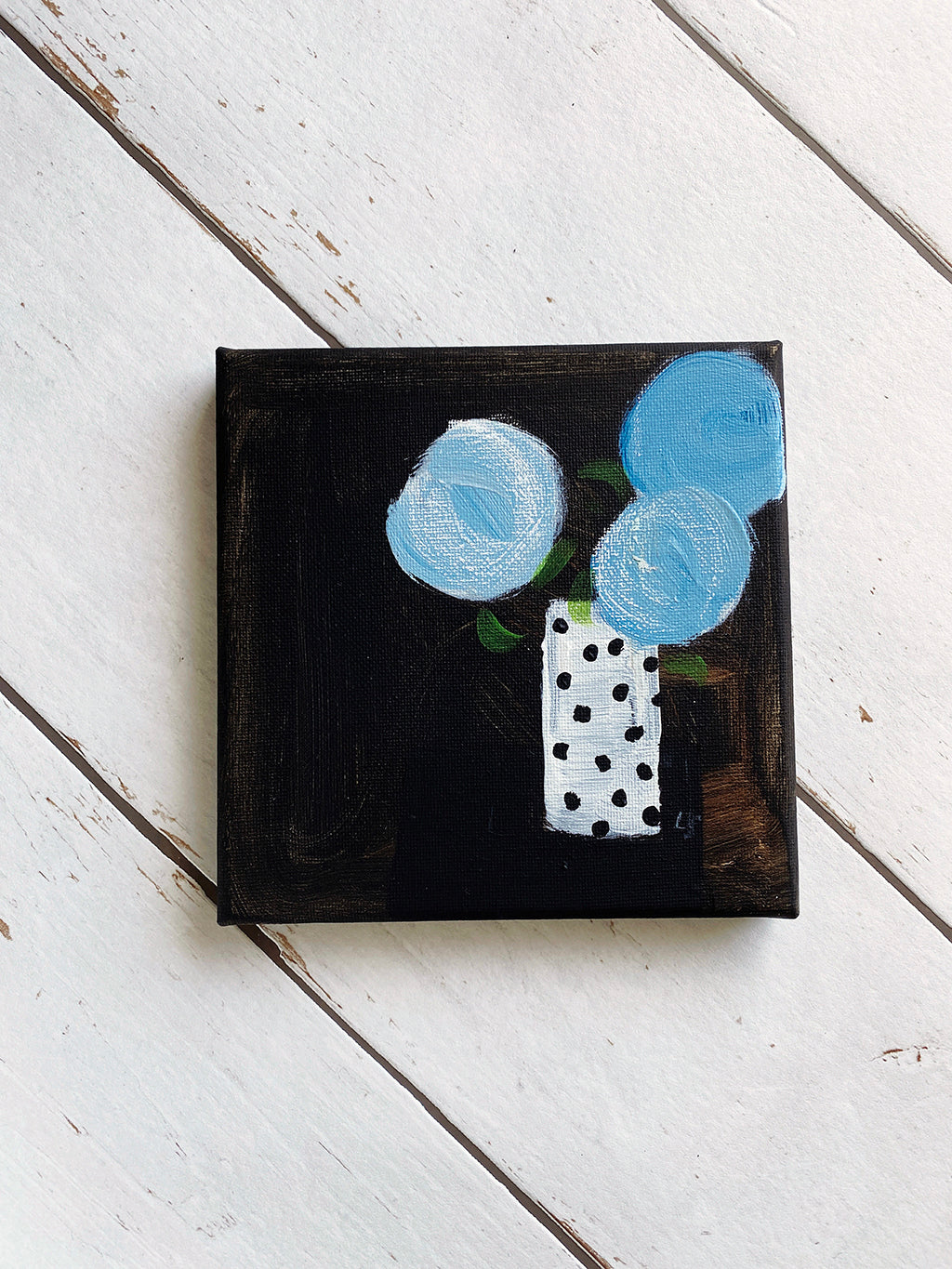 Three Blue Blooms In Mum's Spotty Vase
