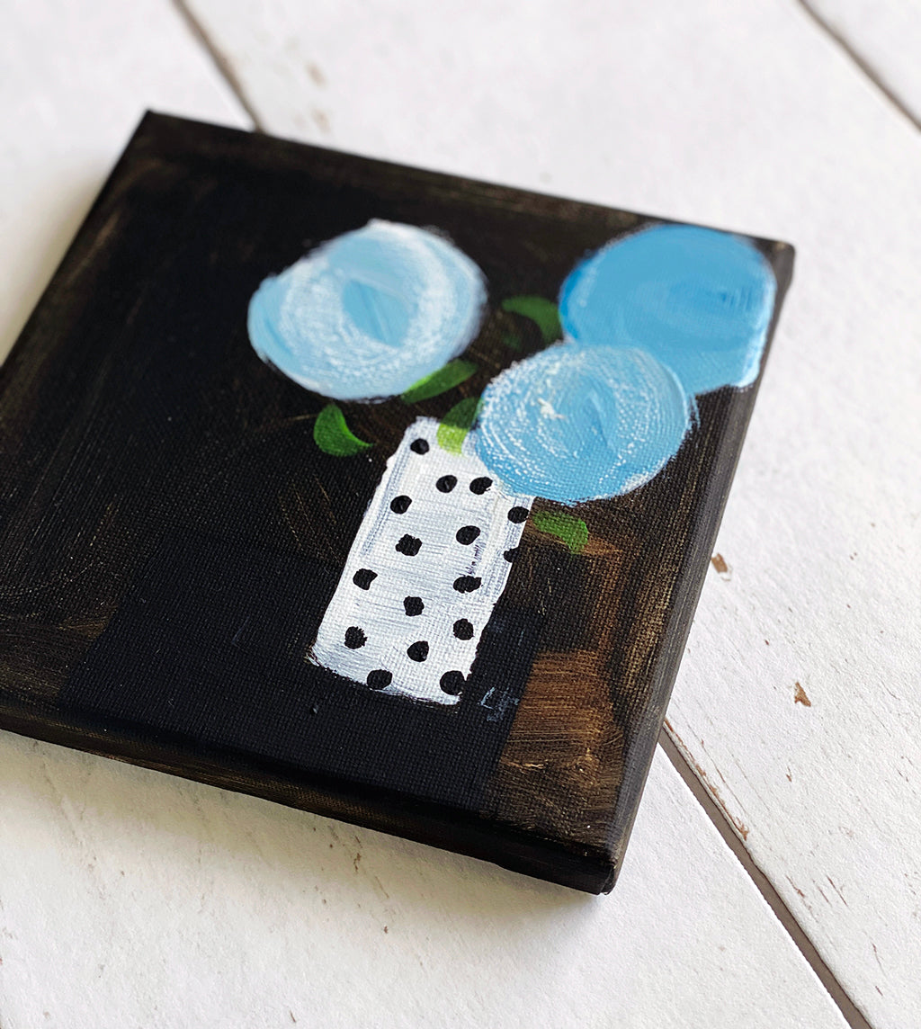 Three Blue Blooms In Mum's Spotty Vase